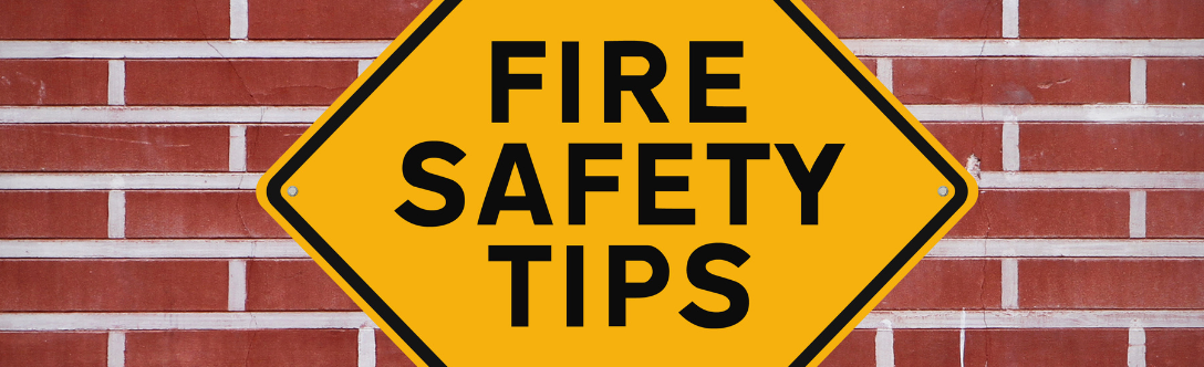 a fire safety sign on a brick wall